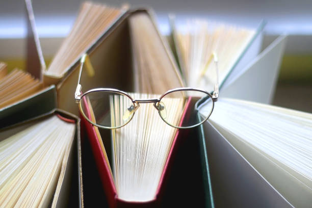 istock Hardcover Books and Reading Glasses 1362772393