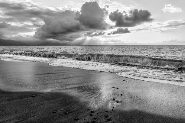 istock Ocean Beach Seascape Sunset Sun Rays Black And White 1362774211