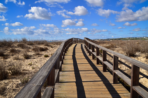 Boardwalk winding through estuarine wetlands and marshes,, Alvor, Algarve coast, South Portugal, Europe