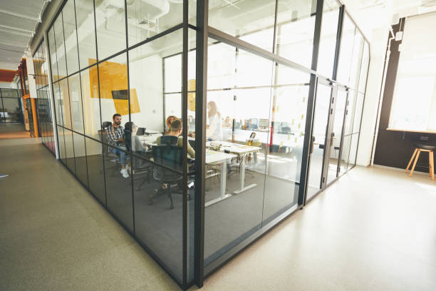 istock Industrious young people working in a cozy modern glass office 1362777425