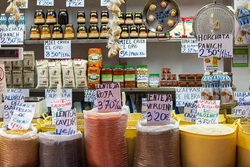 Lentils at Mercado Central (Central Market) in Valencia, Spain, with much commercial packaging visible.