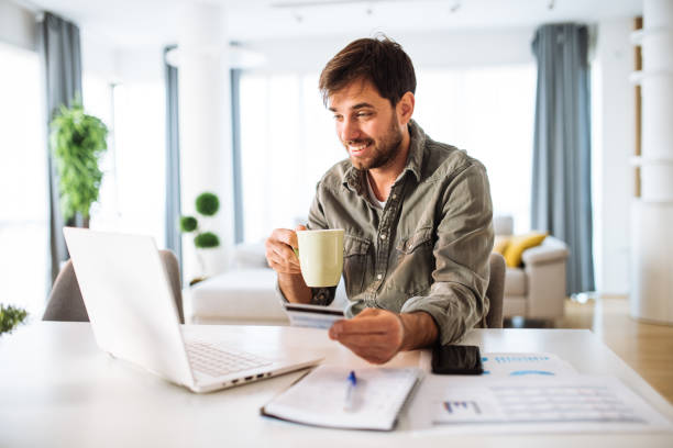 istock Young entrepreneur working on laptop at home 1362785132