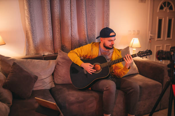 istock Young vlogger, guitarist filming his vlogg 1362785149