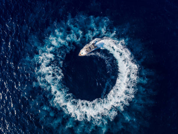 istock Boat breaking waves in mediterranean blue sea 1362786677