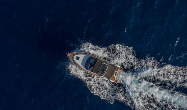 istock Boat breaking waves in mediterranean blue sea 1362786678