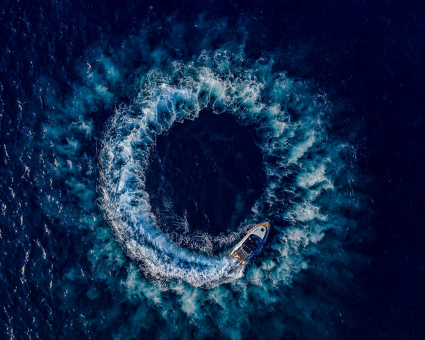 istock Boat breaking waves in mediterranean blue sea 1362786685