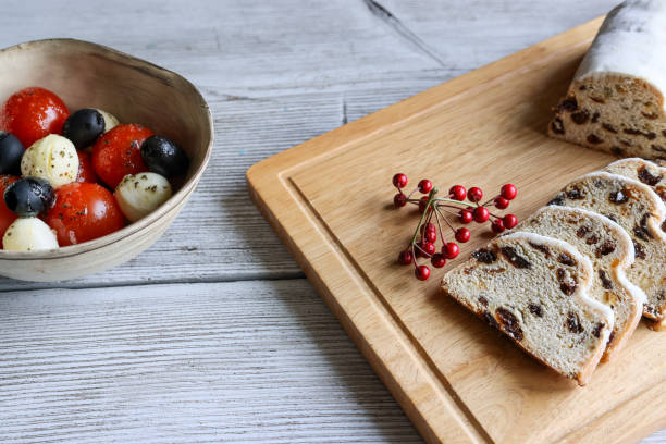 istock Mozzarella cheese salad and stollen on the wooden table. 1362786689