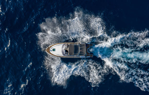 istock Boat breaking waves in mediterranean blue sea 1362786696