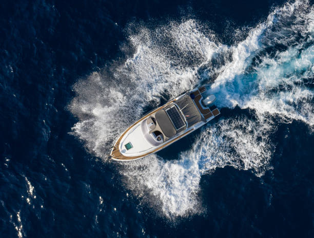 istock Boat breaking waves in mediterranean blue sea 1362786707