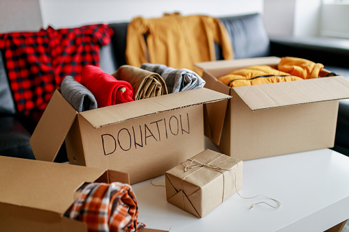 Donation box with stuff (blankets and clothes)