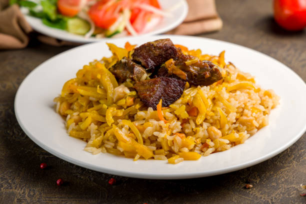 istock pilaf with beef on white plate close up , uzbek cuisine 1362787563