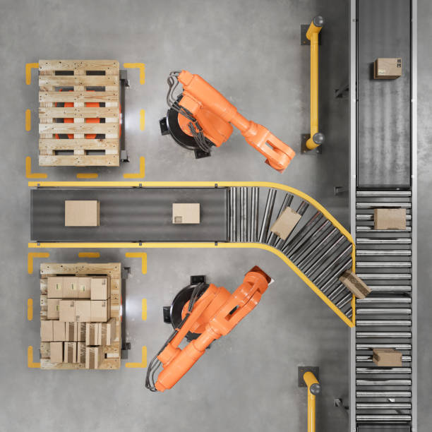 industrial robots working on a conveyor belt in a smart warehouse - driverless train imagens e fotografias de stock