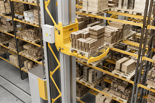 3d render of modern automated warehouse management system. Computer-generated image of automated elevator moving and arranging cardboard boxes on storage racks in a distribution warehouse.