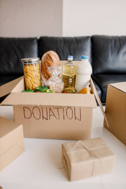 istock High angle view of a cardboard box filled with multicolored non-perishable canned goods, conserves, sauces and oils 1362789859