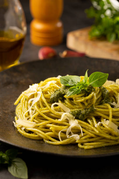 istock Pasta spaghetti with pesto sauce and basil leaf. 1362790141