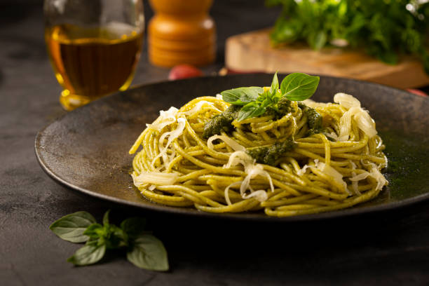 istock Pasta spaghetti with pesto sauce and basil leaf. 1362790154