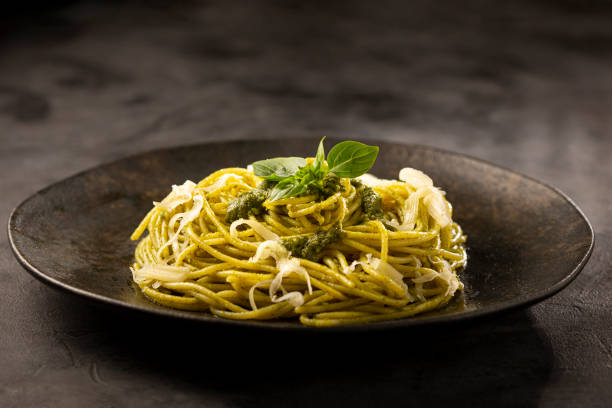 istock Pasta spaghetti with pesto sauce and basil leaf. 1362790157