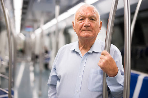 istock Elderly man in subway train 1362790195