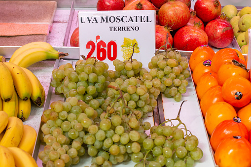 White Grapes at Mercado Central (Central Market) in Valencia, Spain, with an illustration of grapes visible