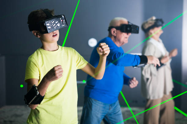 istock Boy in VR headset playing games with his family 1362790988