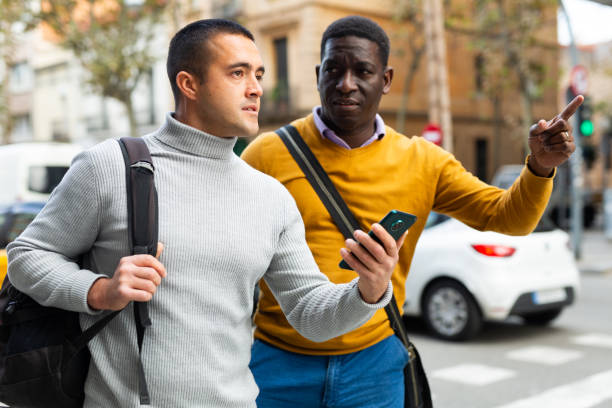 istock Men talking about directions outdoors 1362791862