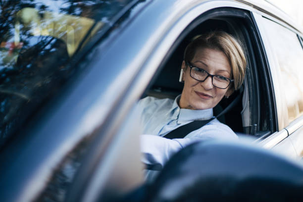 istock Mature woman driving a car. 1362793184