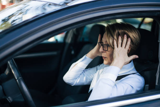 istock Mature woman driving a car. 1362794012