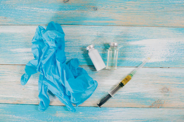 istock ampoules and syringe on a wooden table 1362795882