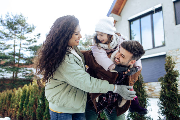 istock Girl having fun with mom and dad on the mountain 1362799352