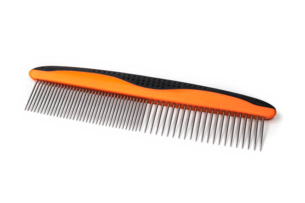 Pet comb for dematting, detangle or remove knots in animal hair. Used by groomers and pet owners to brush or maintain cat and dog fur. Isolated on white. Selective focus. deep pick stock pictures, royalty-free photos & images