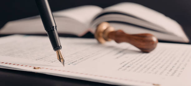 Agreement concept with fountain pen and documents stock photo