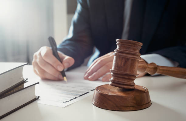 Lawyer working in the office. Singing agreement