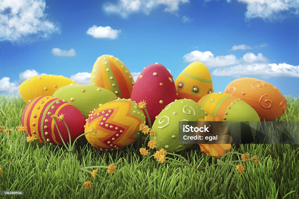 Colorful easter eggs Colorful easter eggs  on green grass Agricultural Field Stock Photo