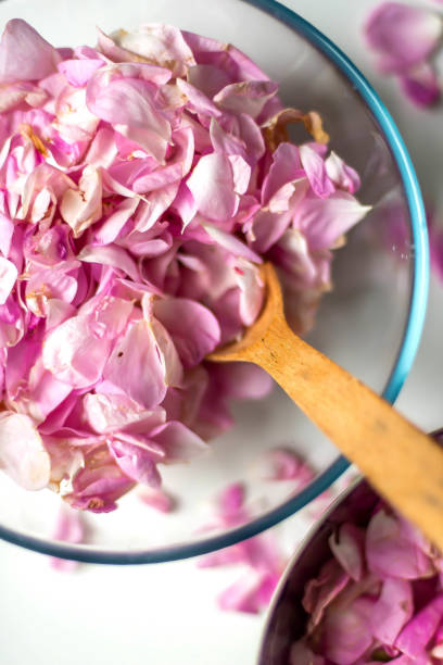 istock Woman Making Pink Rose Petal Jam in kitchen 1362809650