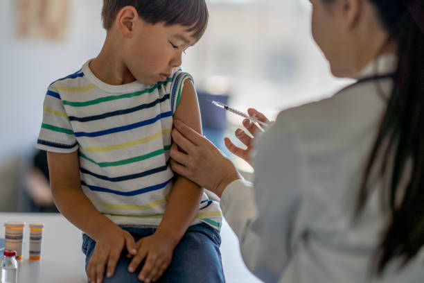 istock Little Boy Unsure of the Needle 1362811150