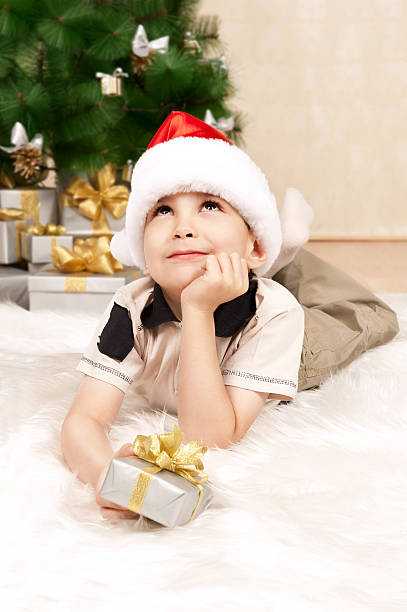istock Child under the Christmas tree with gifts 136281168