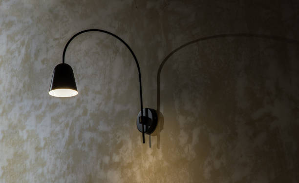 istock Black lamp on grunge concrete cement wall in loft style. 1362814362