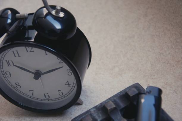 istock Retro alarm clock and ashtray , on the floor 1362820598