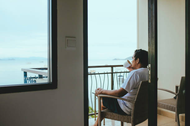 asian man drink coffee in the morning