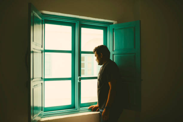 Asian taking In The View from His  Room