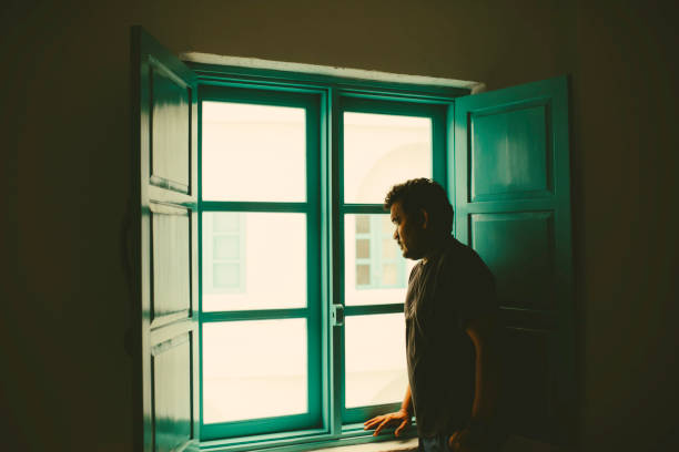 istock Asian taking In The View from His  Room 1362827724