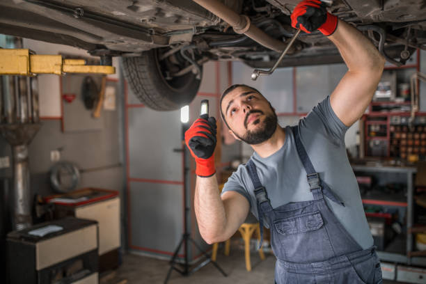 istock Mechanic with protective gloves holding torch 1362834197