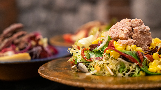 Tuna and vegetable salad on background
