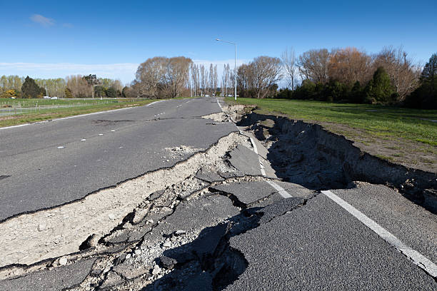 Road damaged by earthquake This road damage was caused by the magnitude 7.1 earthquake that occurred near Christchurch, New Zealand on 4 September 2010. Through the failure of the road, it shows the fragility of built infrastructure that we depend upon every day. What would happen if your business was unable to ship its products due to damaged road networks? How resilient would you be to  an earthquake? earthquake photos stock pictures, royalty-free photos & images