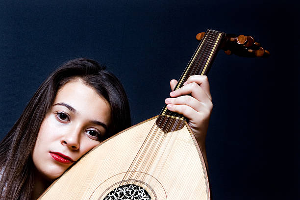 Woman playing oud or (ud)