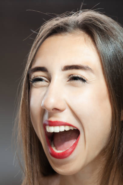 istock Beautiful brunette girl studio portrait. Screaming and surprised expression. 1362840102