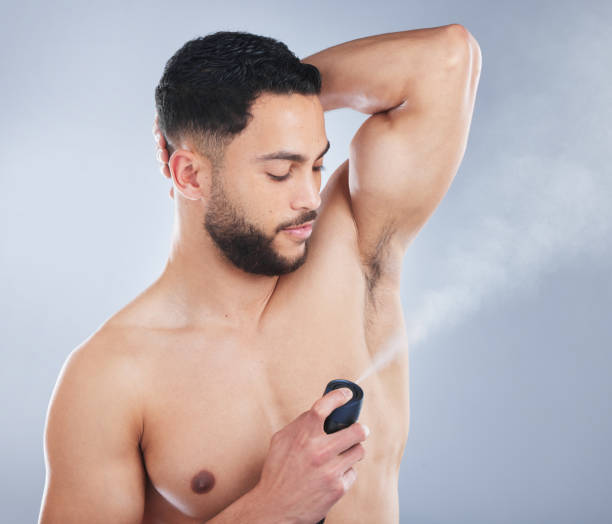 istock Studio shot of a handsome young man applying deodorant against a grey background 1362840713