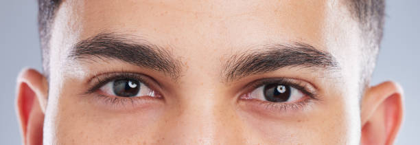 istock Shot of an handsome young man’s eyes against a studio background 1362840913