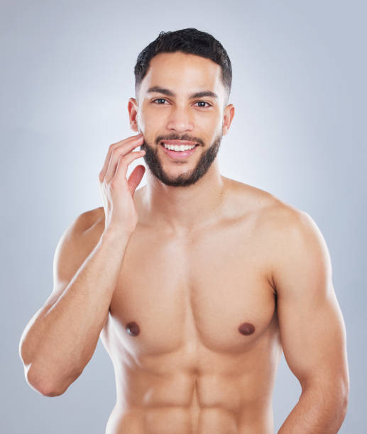 istock Studio shot of a handsome young man touching his face against a grey background 1362840916
