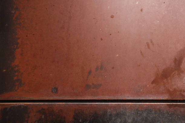 Part of a patterned brown metal wall.